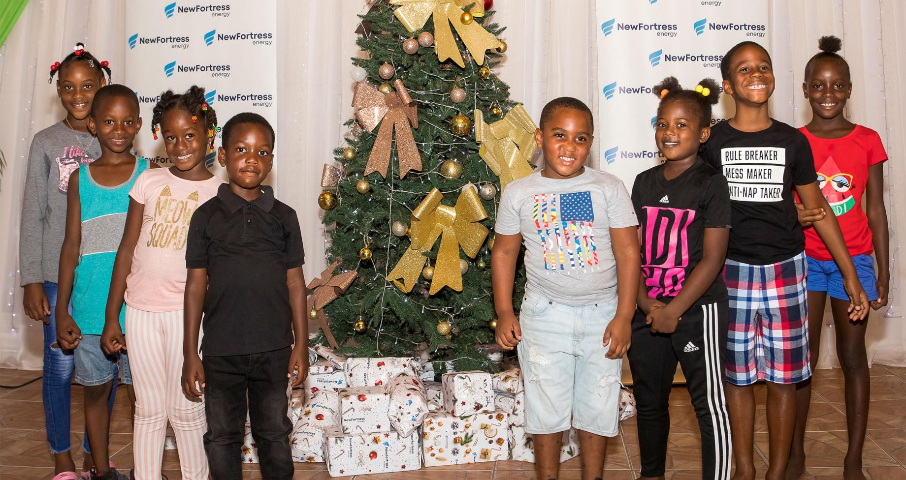 children receiving holiday presents in Jamaica