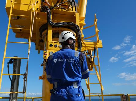 NFE employee standing on LNG terminal