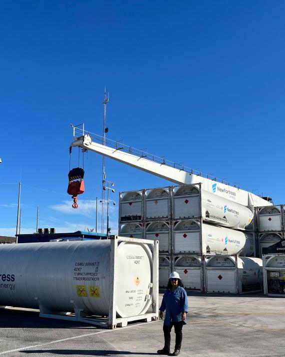 NFE employee standing on LNG plant 