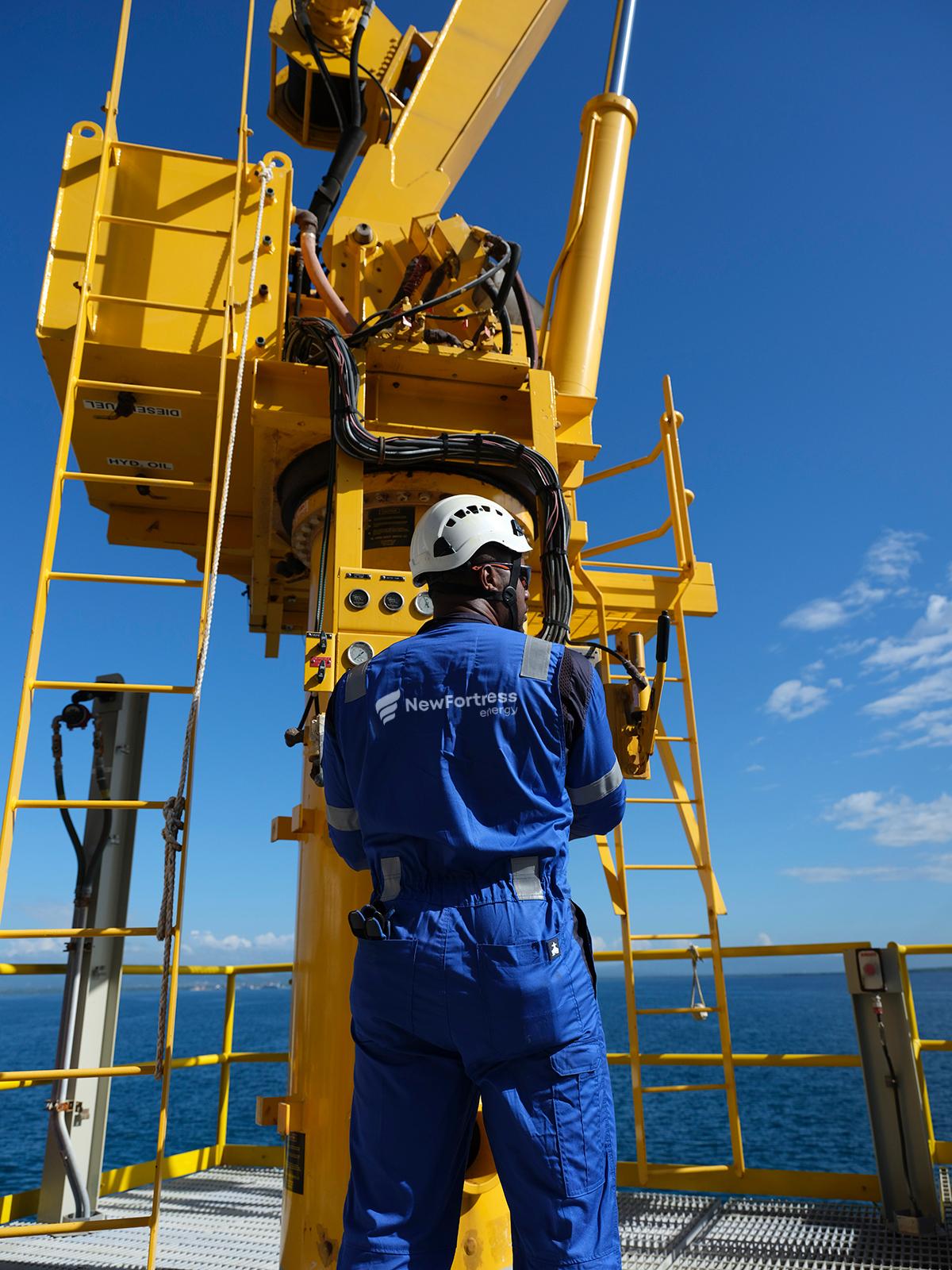 NFE employee standing on LNG plant 