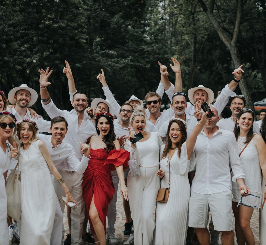 Group of people standing together celebrating 