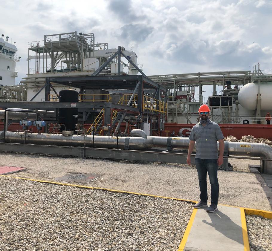 NFE employee standing on LNG plant 