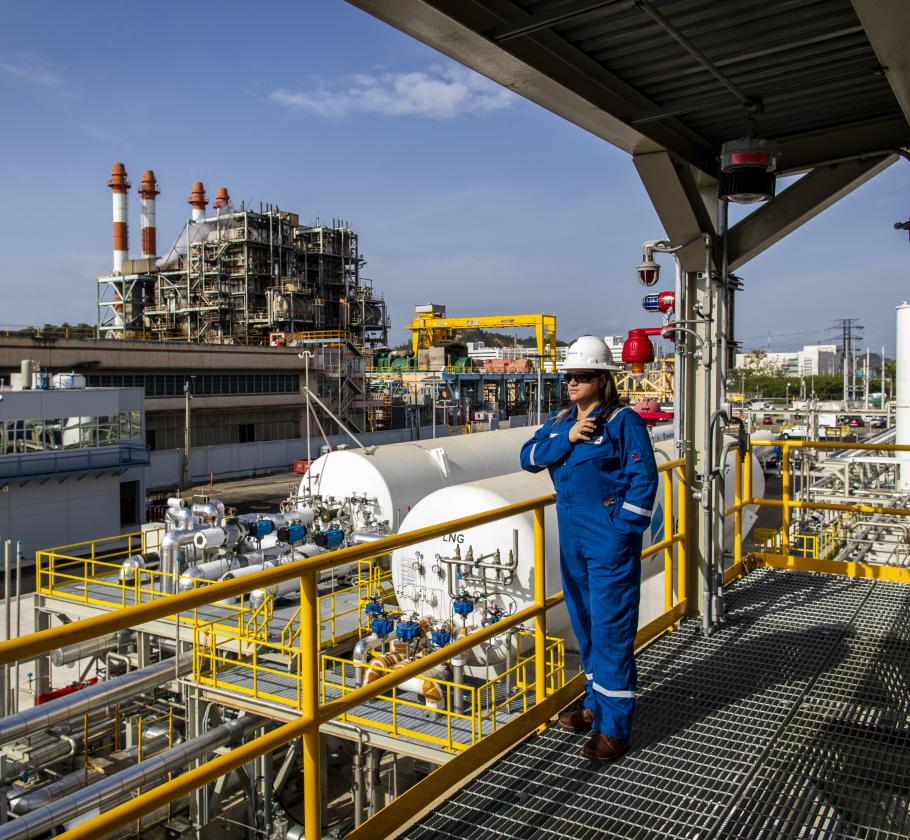 NFE employee standing on LNG plant 